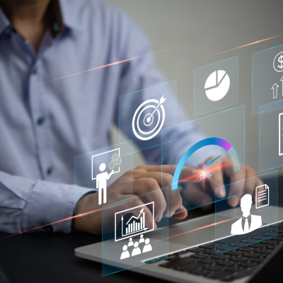 Business professional analyzing website metrics on a laptop with performance icons overlaid, representing WordPress performance optimization services.